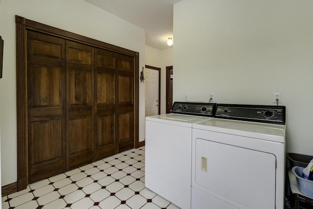 laundry room featuring laundry area, separate washer and dryer, and light floors