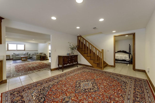 corridor featuring light tile patterned floors