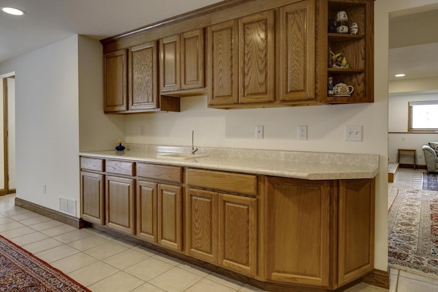 kitchen featuring sink and light tile patterned floors