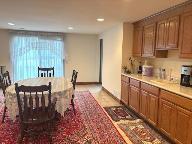 dining room featuring light tile patterned floors, visible vents, baseboards, and recessed lighting