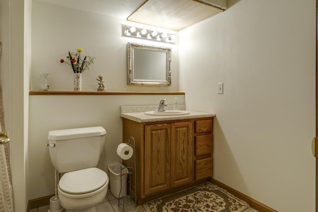 bathroom featuring vanity, tile patterned floors, and toilet