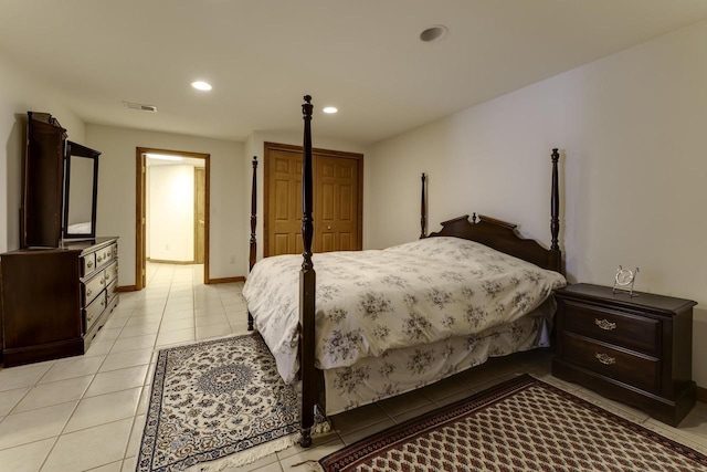 bedroom featuring visible vents, recessed lighting, a closet, light tile patterned flooring, and baseboards