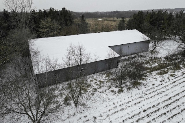 snowy aerial view featuring a rural view