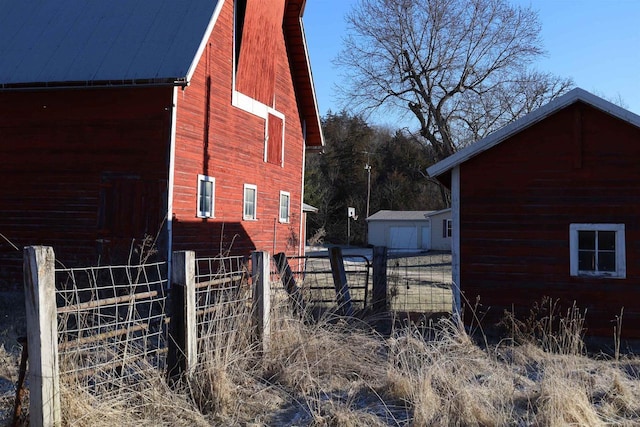 view of side of home with an outbuilding