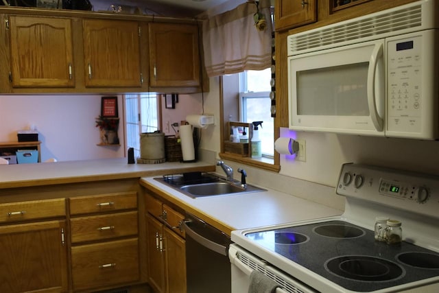 kitchen with sink and white appliances