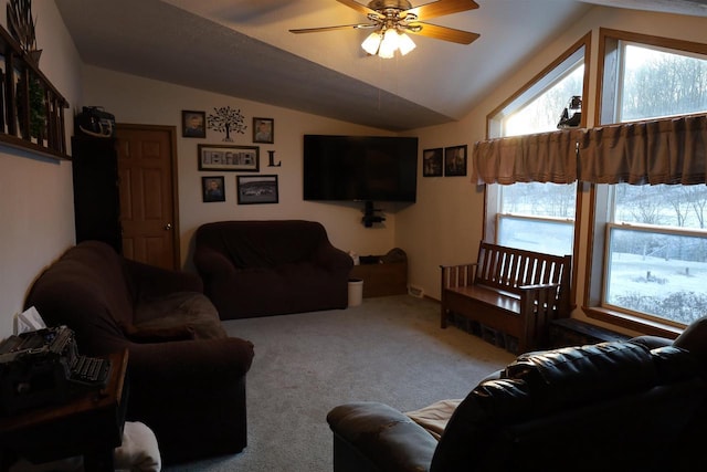 living room featuring ceiling fan, light colored carpet, and vaulted ceiling