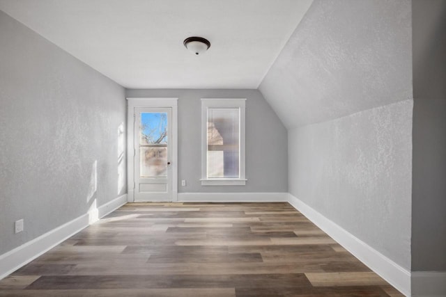 bonus room featuring hardwood / wood-style floors and lofted ceiling