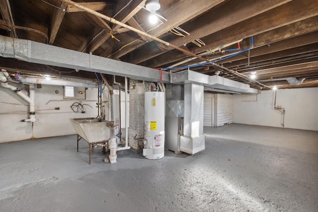 basement with sink, heating unit, and water heater