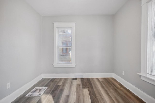 unfurnished room featuring hardwood / wood-style flooring