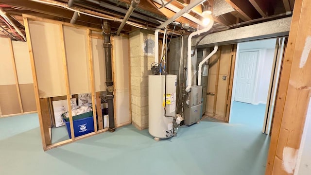 basement featuring heating unit and water heater