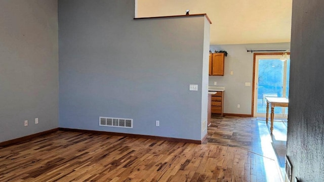 unfurnished room with dark hardwood / wood-style floors