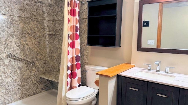 bathroom with toilet, vanity, and a shower with shower curtain