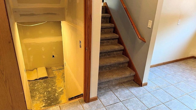 staircase with tile patterned floors