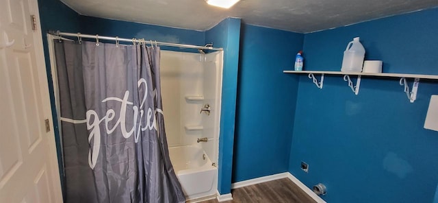 bathroom with shower / bath combo with shower curtain and wood-type flooring