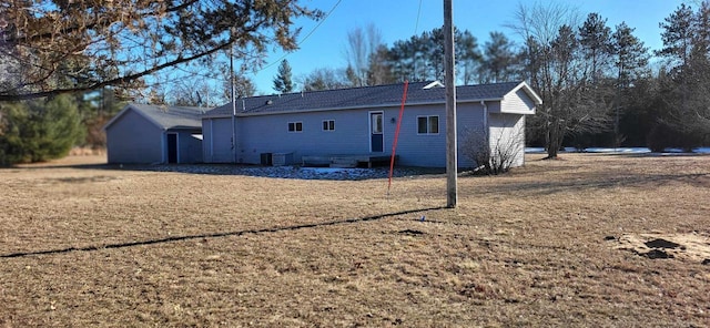 rear view of house featuring central AC