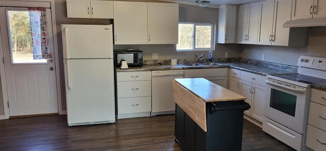 kitchen featuring dark hardwood / wood-style flooring, sink, wooden counters, white cabinetry, and white appliances