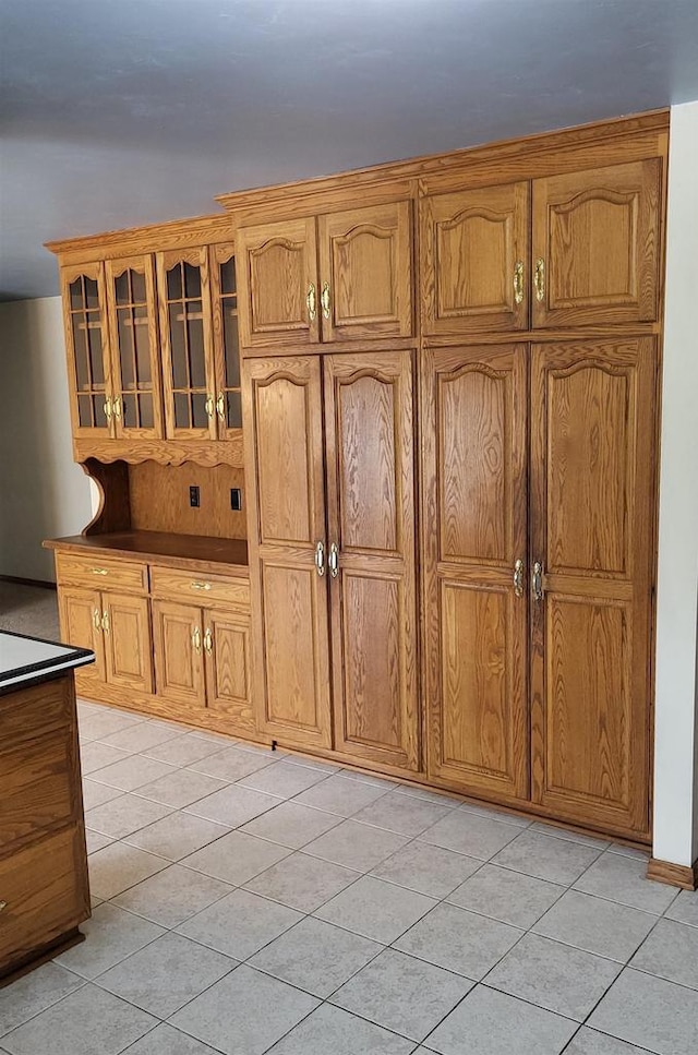 kitchen with light tile patterned floors