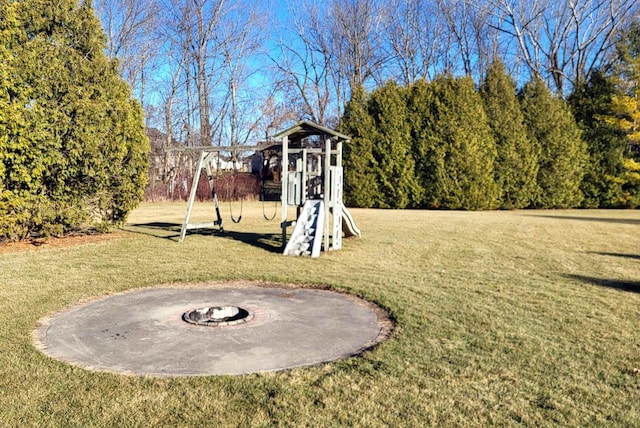 view of yard with a fire pit and a playground