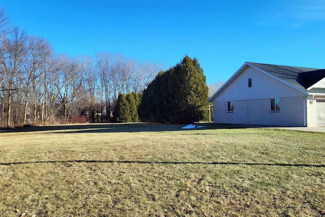 view of yard featuring a garage