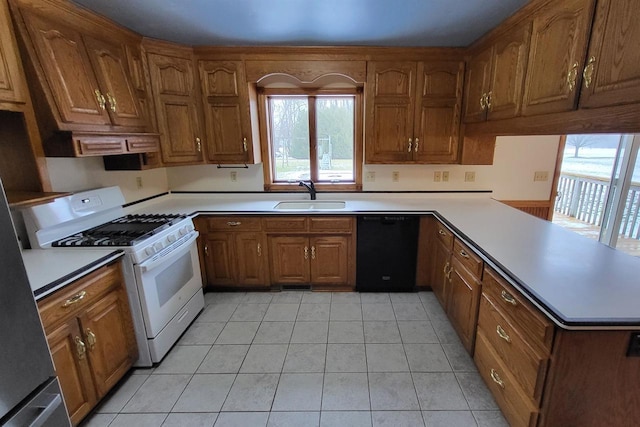 kitchen with sink, dishwasher, light tile patterned flooring, kitchen peninsula, and white gas stove