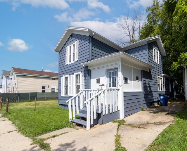 view of front of home with a front lawn