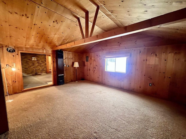 bonus room featuring wooden ceiling, lofted ceiling, wood walls, and carpet flooring