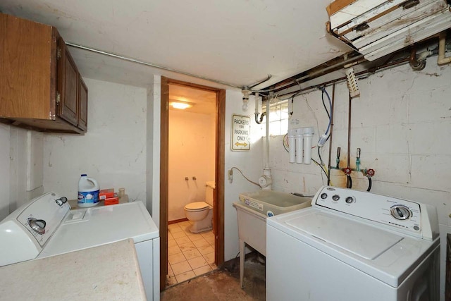 laundry area featuring cabinets and separate washer and dryer