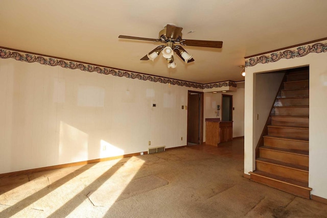 carpeted empty room with ceiling fan