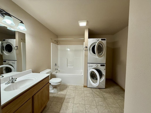 full bathroom featuring shower / bathtub combination, stacked washer / dryer, toilet, and vanity