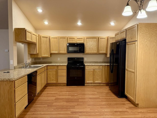 kitchen featuring decorative light fixtures, sink, light brown cabinets, and black appliances