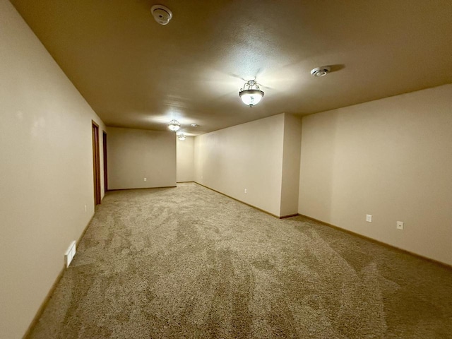 unfurnished room featuring carpet flooring