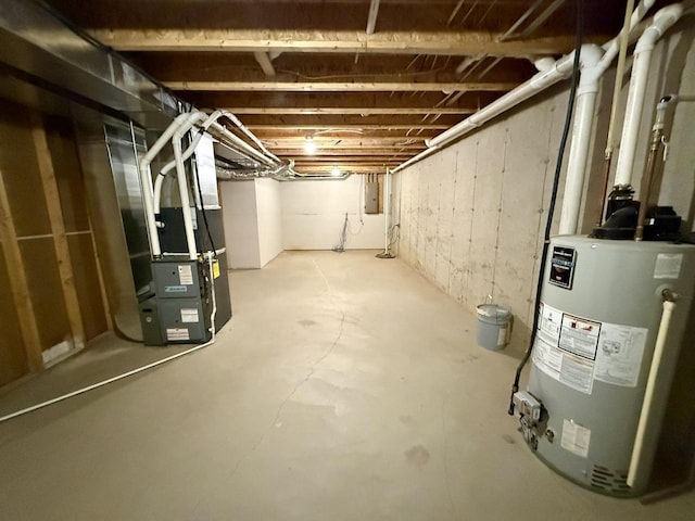 basement with heating unit, electric panel, and gas water heater