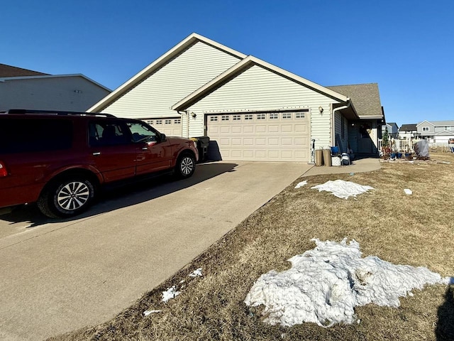 view of side of home with a garage