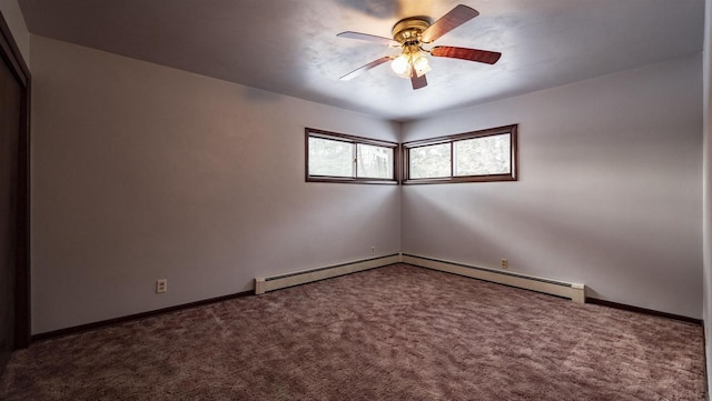 carpeted empty room featuring ceiling fan and a baseboard radiator