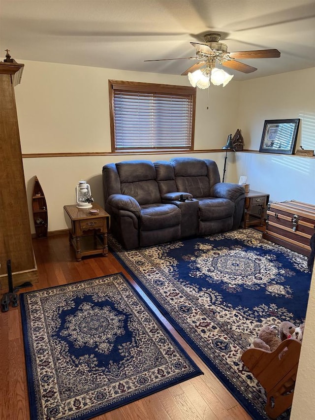 living room with hardwood / wood-style floors and ceiling fan