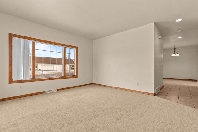 spare room with light colored carpet