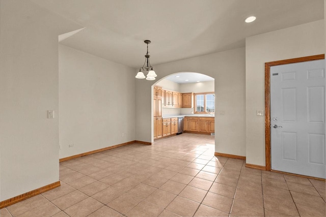 interior space featuring a notable chandelier and light tile patterned flooring