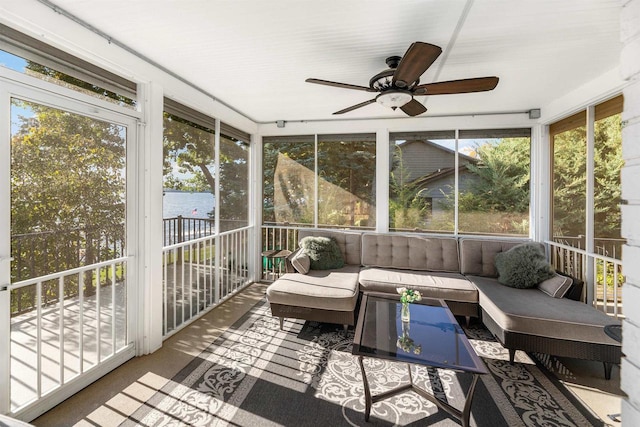 sunroom featuring ceiling fan