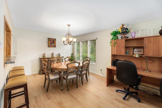 dining area featuring light hardwood / wood-style floors and a notable chandelier