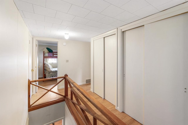 corridor featuring light hardwood / wood-style flooring