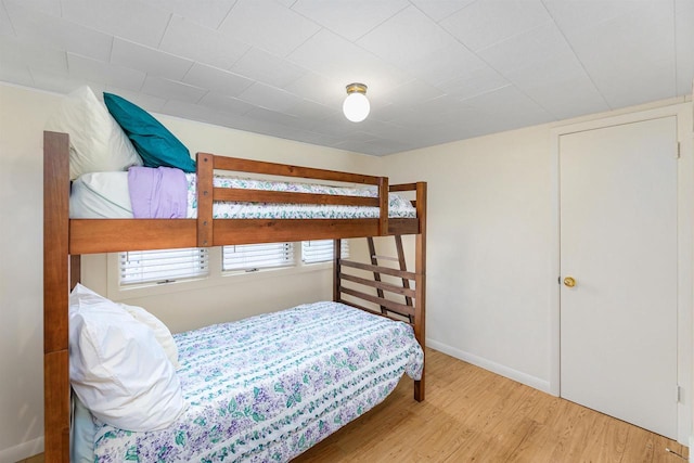 bedroom with hardwood / wood-style flooring