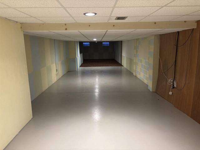 hall with concrete flooring