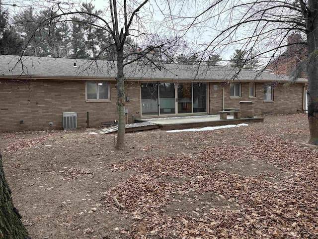 back of house featuring a patio area and central air condition unit