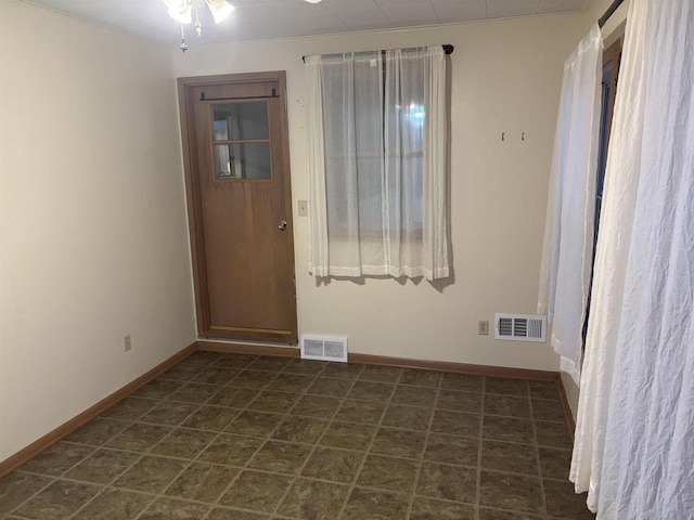 unfurnished room with ceiling fan