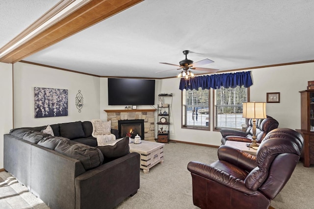 living room featuring ceiling fan, light colored carpet, a fireplace, and crown molding