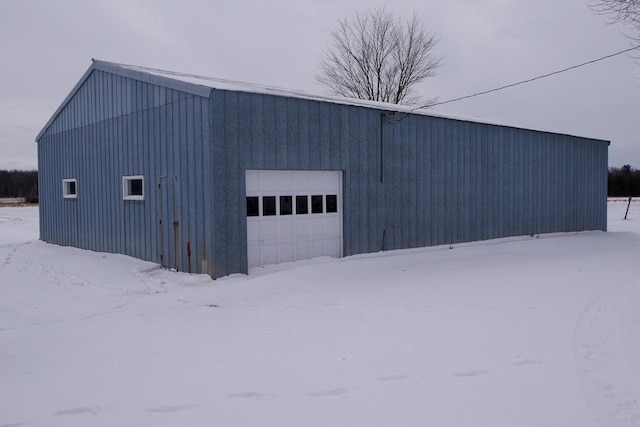 view of snow covered garage