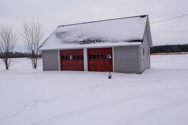 view of snow covered garage