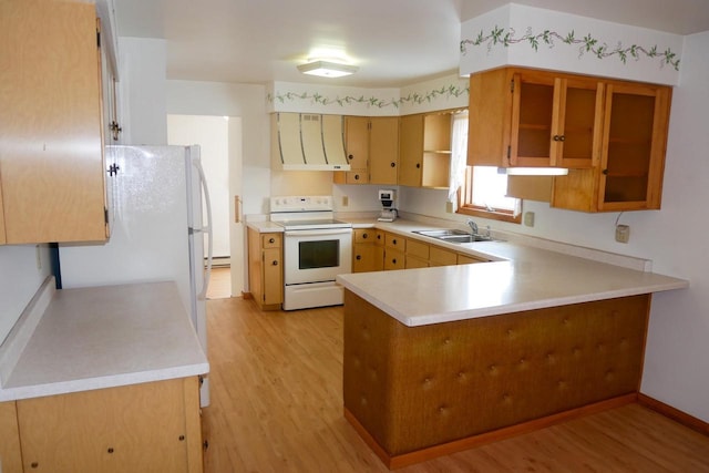 kitchen with extractor fan, kitchen peninsula, sink, white appliances, and light wood-type flooring