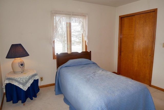 carpeted bedroom with a closet