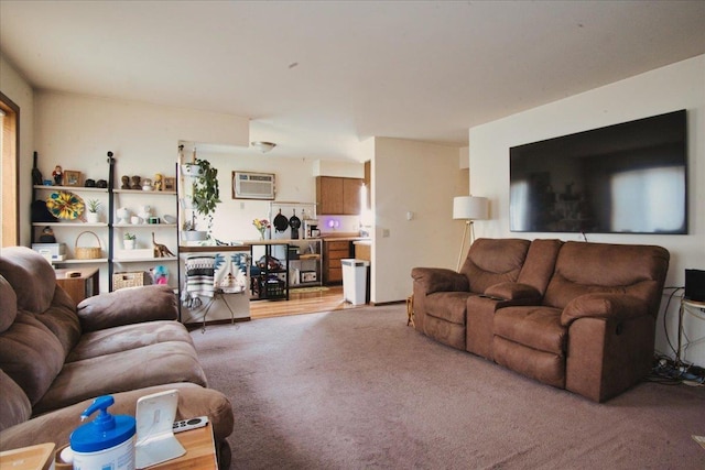 living room with carpet floors and a wall mounted AC